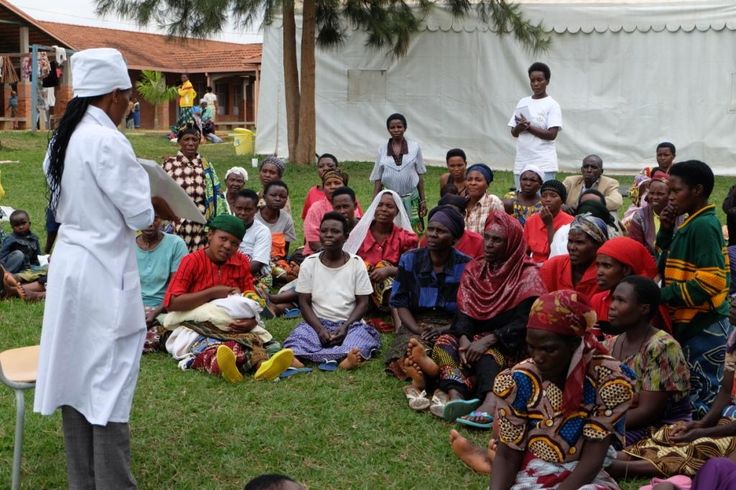 Field officer conducting a community interview for project monitoring.